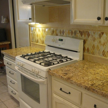 Juparana Granite counter-top with a rhomboid onyx back-splash