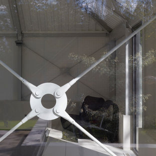 Design ideas for a medium sized contemporary multi-use home gym in London with white walls, ceramic flooring and white floors.