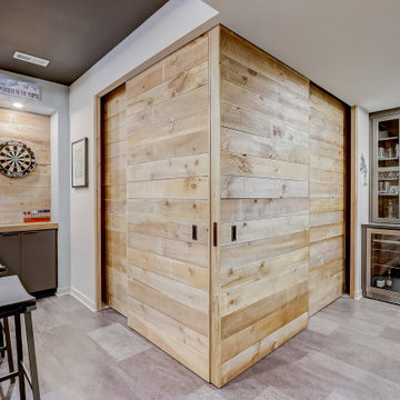 Lower Level Oversized Custom-Made Doors Recess into Walls Creating Exercise Area