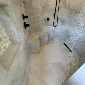 Curd-less walk-in shower; heated floors in bathroom + shower+bench LED