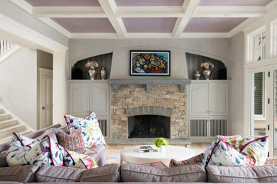 Example of a mid-sized transitional light wood floor, beige floor and coffered ceiling living room design in Minneapolis with a standard fireplace, a stone fireplace and no tv