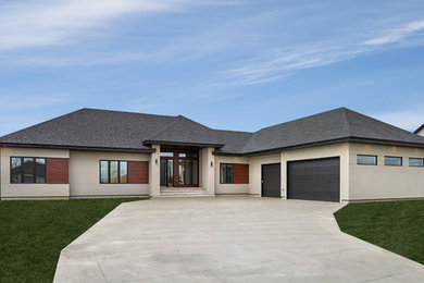 Large contemporary beige one-story stucco exterior home idea in Edmonton