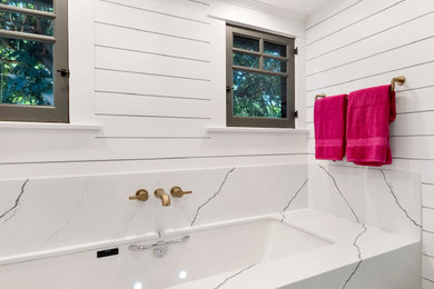 Large minimalist master white tile ceramic tile, gray floor, single-sink and wall paneling bathroom photo in Los Angeles with shaker cabinets, blue cabinets, a one-piece toilet, white walls, a drop-in sink, quartzite countertops, a hinged shower door, white countertops and a freestanding vanity