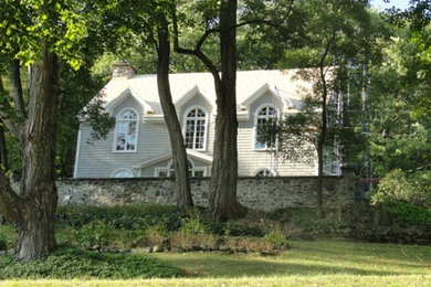 Mid-sized elegant gray two-story wood exterior home photo in Montreal