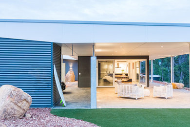 Design ideas for an expansive contemporary one-storey grey exterior in Perth with mixed siding and a shed roof.