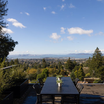 Rooftop dining deck with panoramic skyline views - Fold House
