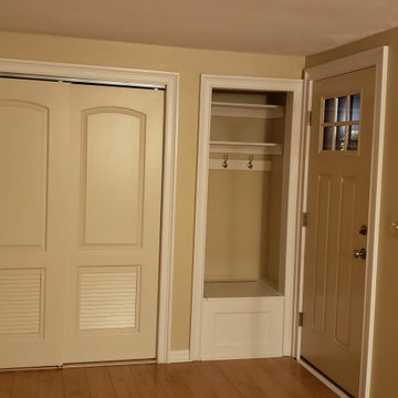 Built in coat hangers and storage box