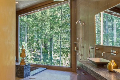 Design ideas for a large contemporary master bathroom in San Francisco with a vessel sink, flat-panel cabinets, dark wood cabinets, an open shower, brown tile, brown walls, granite benchtops, porcelain tile, limestone floors and an open shower.
