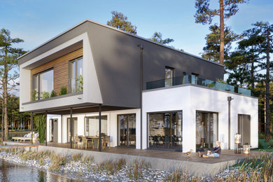 Foto de fachada de casa gris contemporánea grande de dos plantas con revestimientos combinados, tejado plano y tablilla