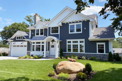Large elegant blue two-story concrete fiberboard and clapboard exterior home photo in New York with a shingle roof and a gray roof