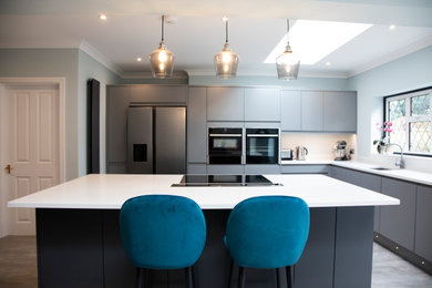 This is an example of a medium sized contemporary kitchen in Surrey.