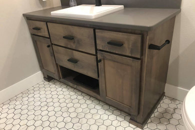 Inspiration for a 3/4 white floor and single-sink bathroom remodel in Other with shaker cabinets, dark wood cabinets, gray walls, gray countertops and a built-in vanity