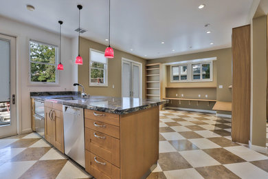 Inspiration for a mid-sized transitional galley separate kitchen in San Francisco with an undermount sink, recessed-panel cabinets, medium wood cabinets, granite benchtops, stainless steel appliances, marble floors, no island and multi-coloured floor.