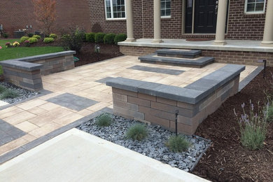 This is an example of a mid-sized modern full sun front yard brick landscaping in Detroit.