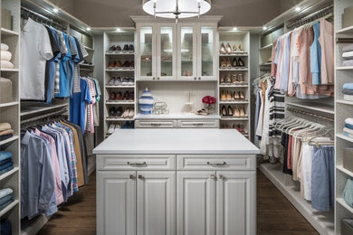 Inspiration for a large contemporary gender-neutral dark wood floor and brown floor dressing room remodel in Seattle with raised-panel cabinets and white cabinets