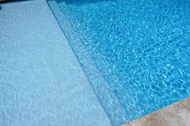 Mid-sized country backyard concrete and rectangular pool photo in Houston