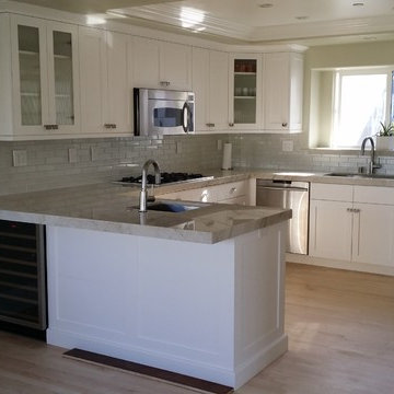 Kitchen Renovation of cabinets with full overlay and counter tops.