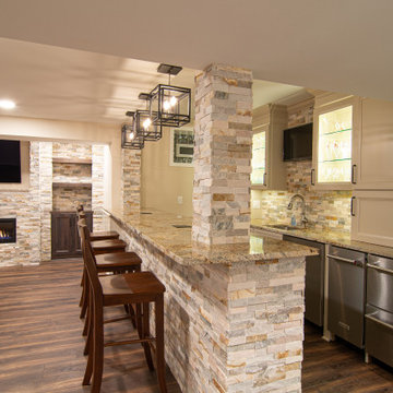 Basement Showing Warm Colors, Straight Lined Cabinets and Stacked Stone