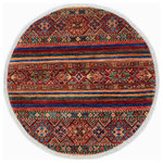 Bareens Designer Rugs - Cabin Khurgeen Pattie Red/Blue Wool Round - 3'2'' x 3'3'' - Designed with a mesmerizing intricate transitional and geometric motif this glorious hand knotted rug made with handspun Ghazni wool is a masterpiece that will fill any space with sophistication and grace. Hand knotted by skilled artisans in an exhilarating color pallet with an elaborate design, this masterpiece features luxurious hand spun wool with all vegetable dyes to add comfort and style to your decor. The design, color, and beautiful chromatic composition with a sheen in transitional and geometric designs, exude beauty, elegance and quality make this rug an extraordinarily opulent center piece for your living space. The intricate designs known as Khurgeen, Khorgeen or Khorjin range are inspired by the patterns from ancient tribal bags. An infusion of bold, saturated color gives this traditional hand-knotted rug a fresh perspective and modern appeal. Most desired due to its versatility in design and affordability this handmade rug is in a compelling focal point in any living area.
