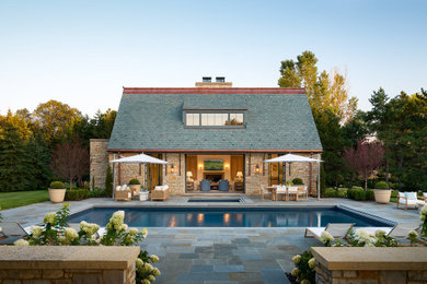 Pool landscaping - huge farmhouse side yard stone and rectangular lap pool landscaping idea in Minneapolis