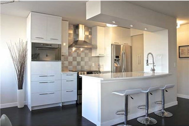 Example of a small trendy galley dark wood floor eat-in kitchen design in Calgary with an undermount sink, flat-panel cabinets, white cabinets, quartzite countertops, metallic backsplash, metal backsplash, stainless steel appliances and an island