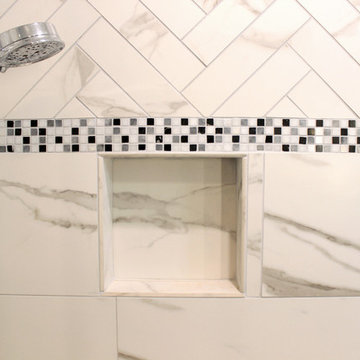 White and Gray MasterBath with Marble Look and Herringbone Tiled Shower
