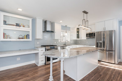 Mid-sized contemporary l-shaped eat-in kitchen in Raleigh with an undermount sink, shaker cabinets, white cabinets, granite benchtops, grey splashback, subway tile splashback, stainless steel appliances, dark hardwood floors, with island and brown floor.