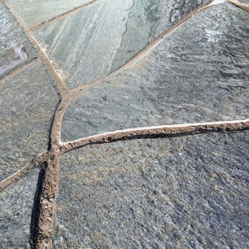 Chocolate Charcoal Quartzite Flagstone Patio with Basalt Column Fountain