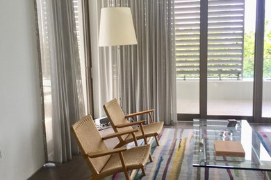 Inspiration for a mid-sized contemporary open concept dark wood floor and brown floor living room remodel in Miami with white walls, no fireplace and no tv