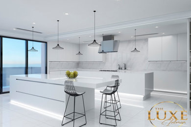 Photo of a large modern u-shaped eat-in kitchen in Las Vegas with a drop-in sink, flat-panel cabinets, white cabinets, quartz benchtops, grey splashback, marble splashback, porcelain floors, multiple islands, white floor and white benchtop.
