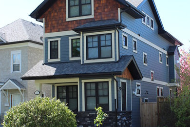 Inspiration for a large timeless blue three-story mixed siding exterior home remodel in Calgary