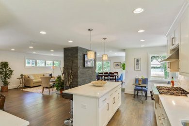 Enclosed kitchen - large contemporary l-shaped light wood floor enclosed kitchen idea in DC Metro with an undermount sink, shaker cabinets, white cabinets, quartz countertops, white backsplash, subway tile backsplash, stainless steel appliances and an island