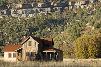 Mountain style wood exterior home photo in Albuquerque