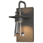 Hubbardton Forge - Erlenmeyer Small Outdoor Sconce, Coastal Natural Iron Finish, Clear Glass - Inspired by the flat-bottomed Erlenmeyer flask, our outdoor sconce provides the catalyst for your design chemistry. The thick, clear blown-glass flask is encircled by a metal collar which is in turn, embedded in a metal plate.