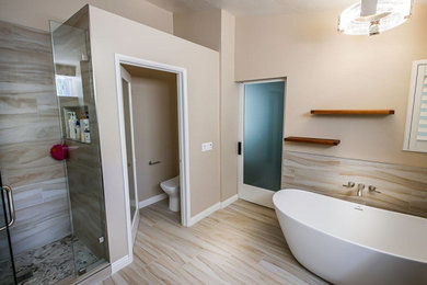 Bathroom - mid-sized modern master beige tile ceramic tile and double-sink bathroom idea in Los Angeles with a built-in vanity, a one-piece toilet, beige walls, an undermount sink, quartzite countertops and a hinged shower door