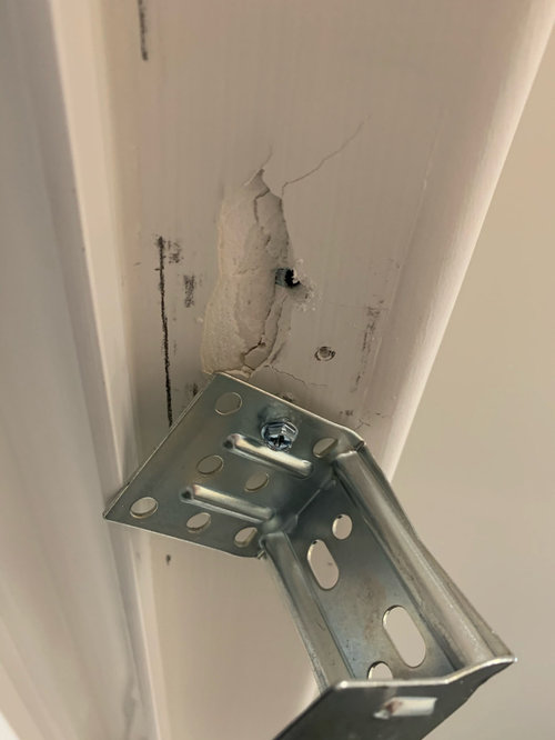 Cracks from drilling on top of window frame