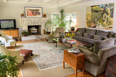 Inspiration for a large eclectic open concept light wood floor family room remodel in New York with gray walls, a standard fireplace, a stone fireplace and a tv stand
