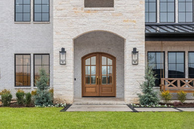Example of a transitional exterior home design in Dallas