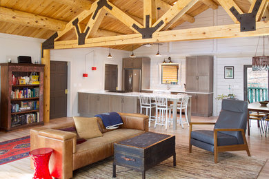 Example of a large minimalist light wood floor and beige floor living room design in New York