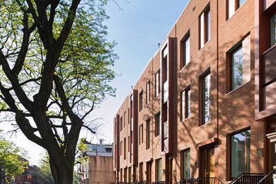 Contemporary three-story brick townhouse exterior idea in New York
