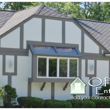 Hardie Stucco Panels, GAF Sienna Shingles, Leaf Relief & Egress Windows