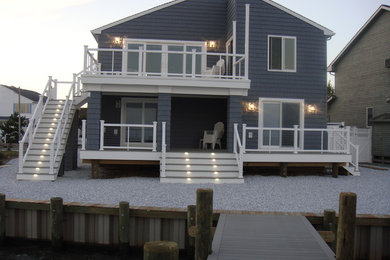 Waterfront Exterior renovation with custom deck and railings