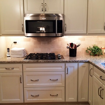 Small White "L" Shaped Kitchen in Naperville by Adam Hartig AKBD