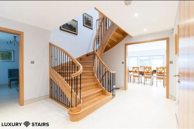 Solid oak stairs with wrought iron spindles