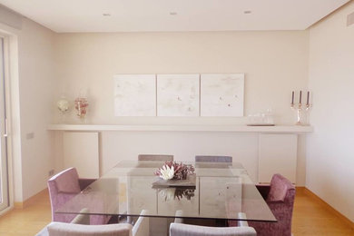Inspiration for a mid-sized transitional medium tone wood floor enclosed dining room remodel in Barcelona with beige walls and no fireplace