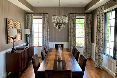 Example of a transitional wallpaper enclosed dining room design