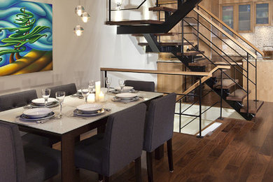Inspiration for a mid-sized contemporary dining room in Vancouver with dark hardwood floors, no fireplace and brown floor.