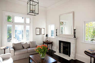 Photo of a transitional living room in Sydney with beige walls.