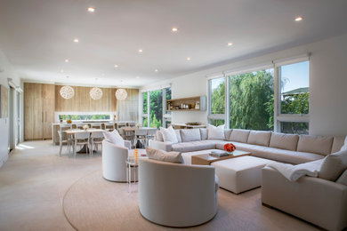 Example of a mid-sized trendy formal and open concept living room design in New York with white walls and no fireplace