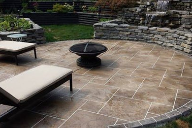Patio - mid-sized traditional backyard concrete patio idea in Salt Lake City with a fire pit and no cover